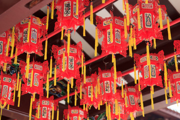 Closeup of red chinese lanterns in buddhistic temple in chinatown, Singapore