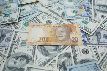 twenty rand against the background of dollars