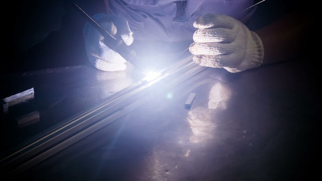 Welding man, welds  tube