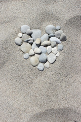 Fototapeta na wymiar Heart / Heart of pebbles in the sand 