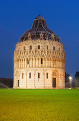 Baptistery at night on Piazza dei Miracoli in Pisa, Italy.