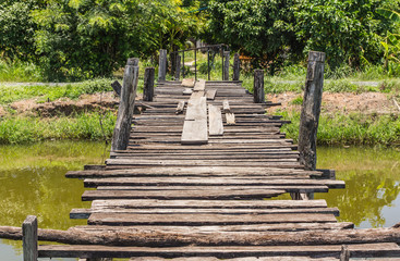 The old wooden bridge on the river