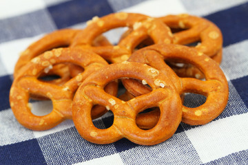 Pretzels on checkered cloth, closeup
