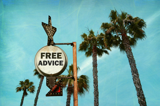 aged and worn vintage photo of free advice sign with palm trees