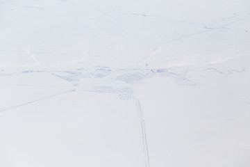 Obraz premium snowy land. view from the airplane