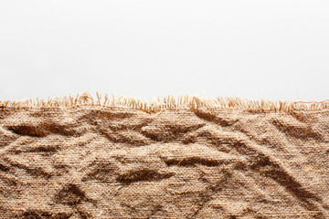 Crumpled burlap with torn edge