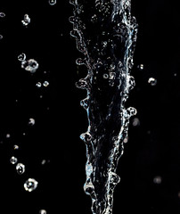 spray water on a black background