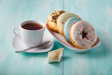 Four donuts on old wood table