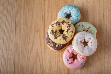 Six donuts on wood table
