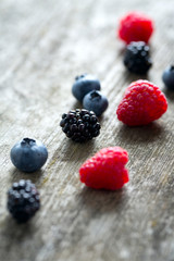 summer berries on wooden surface
