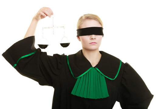 woman barrister holding scales.