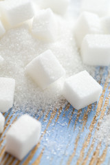 white sugar cubes on wooden surface