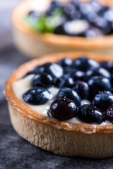 Homemade blueberry tart on marble board