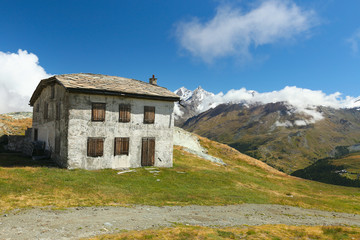 Fototapeta na wymiar Zermatt, view of a mountain hut at lake Schwarzsee, Valais, Switzerland