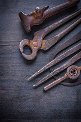 old rusted tools on  vintage board