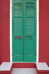 Old freshly painted doors in French Quarter near Bourbon Street in New Orleans, Louisiana