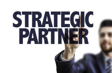 Business man pointing the text: Strategic Partner