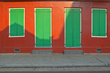 Old freshly painted doors and windows in French Quarter near Bourbon Street in New Orleans, Louisiana