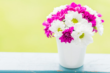 Boquet of flower in vase with outdoor view background