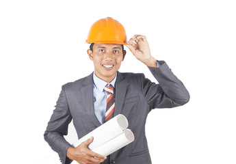 Portrait of young architect holding blueprint  isolated on white background