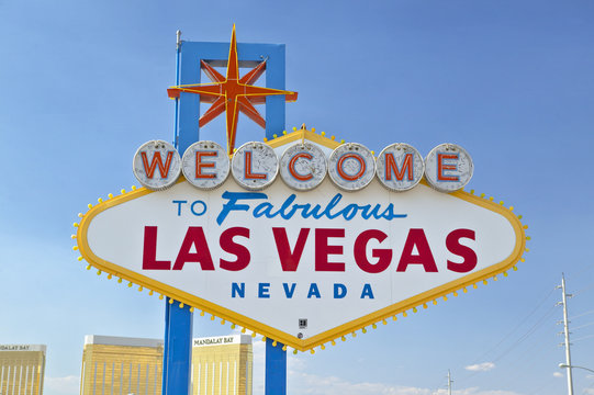 Colorful sign reads ÒWelcome to Fabulous Las Vegas, NevadaÓ in daytime with blue sky