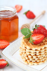 Waffles,honey, mint and ripe strawberries