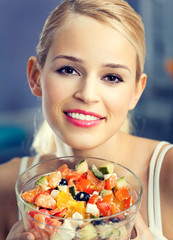 woman with vegetarian salad at home