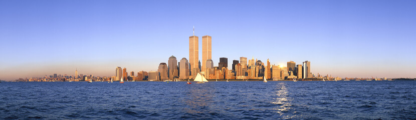 Panoramic view of sailboat on the Hudson River, lower Manhattan and New York City skyline, NY with...