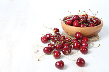 Ripe cherry in a wooden bowl
