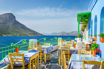 Panoramic view on typical Greek restaurant, Greece - obrazy, fototapety, plakaty