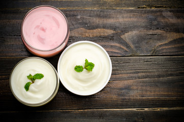 Homemade yogurt on wooden background (Top view)
