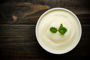 Homemade yogurt on wooden background