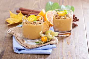 Pumpkin smoothie with granola on top