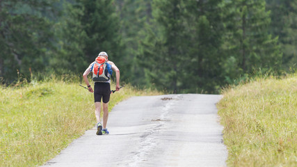 Obraz premium Senior hiker in mountains