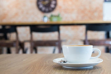Hot art Latte Coffee in a cup on wooden table