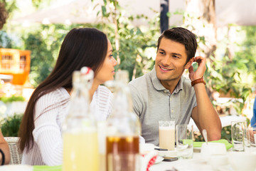 Couple sitting in outdoor restaurant