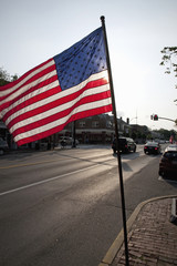American Flag over streets of Lexington, MA on Memorial Day, 2011