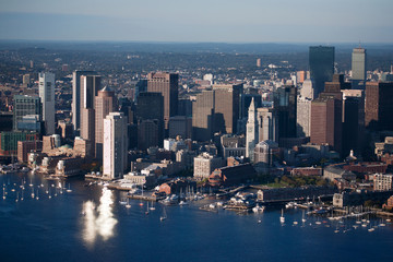 AERIAL morning view of Boston Skyline and Financial Districtas sunlight reflects off windows, Boston, MA.