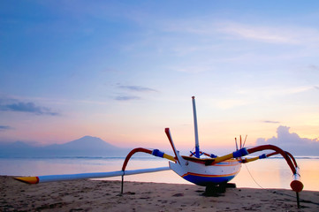 Traditional fishing boats on a beach in Sanur on Bali. Indonesia
