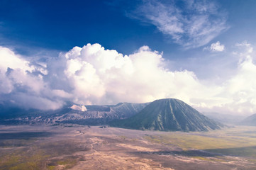 Fototapeta premium Mount Bromo volcano during sunrise, the magnificent view of Mt. Bromo located in Bromo Tengger Semeru National Park, East Java, Indonesia.