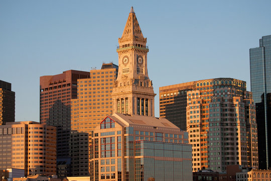 Commerce House Tower (built 1910) and Boston Skyline at sunrise as photographed from Lewis Wharf, Boston, MA.