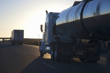Fototapeta na wymiar Fuel truck into setting sun on Interstate 15 in California.