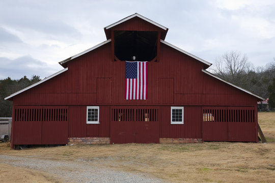 Red Barn and US Flag outside of Franklin, Tennessee, a suburb south of Nashville, Williamson County, Tenn..