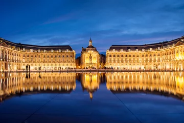 Fotobehang Place la Bourse in Bordeaux, the water mirror by night, France © Delphotostock