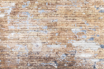 Old grungy yellow brick wall background texture