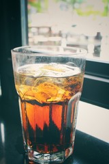 Cola with ice cubes
