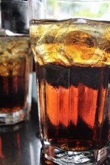 Cola with ice cubes