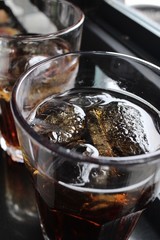 Cola with ice cubes