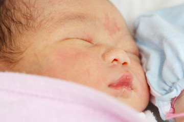 Asian Newborn Baby Girl Sleeping Isolated on White Background.