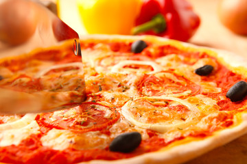 Italian Pizza on Wooden Background.